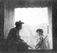 Two soldiers of a Scottish regiment at the door of a farm building among the mountains of Macedonia which they have made their home. (c) IWM