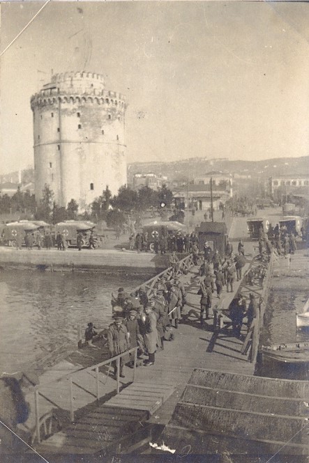 A splendid view of Salonika's White Tower taken from a ship, showing RAMC ambulances waiting. A photo belonging to Corporal Herbert Beacock RAMC.