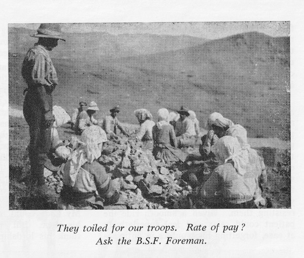 A photograph from 'The Mosquito' showing local labourers - mainly women - breaking rocks for us in road mending.