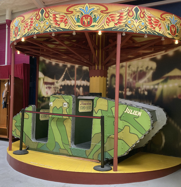 A British First World War tank as a children's fairground carousel ride at the Tank Museum.